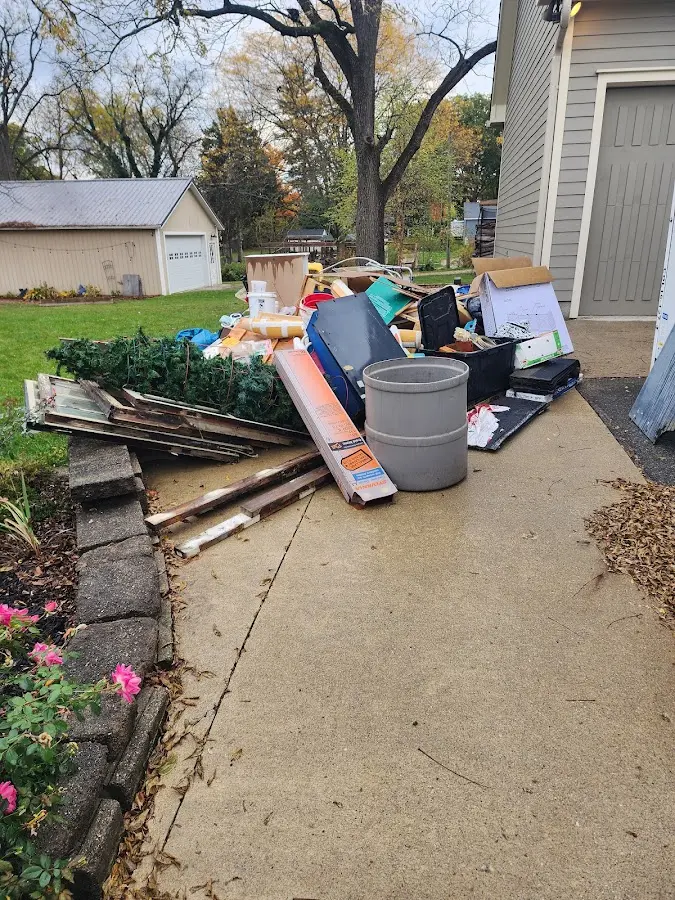 Dumpster being loaded with debris for 30 Yard Dumpster Rental in Delhi
